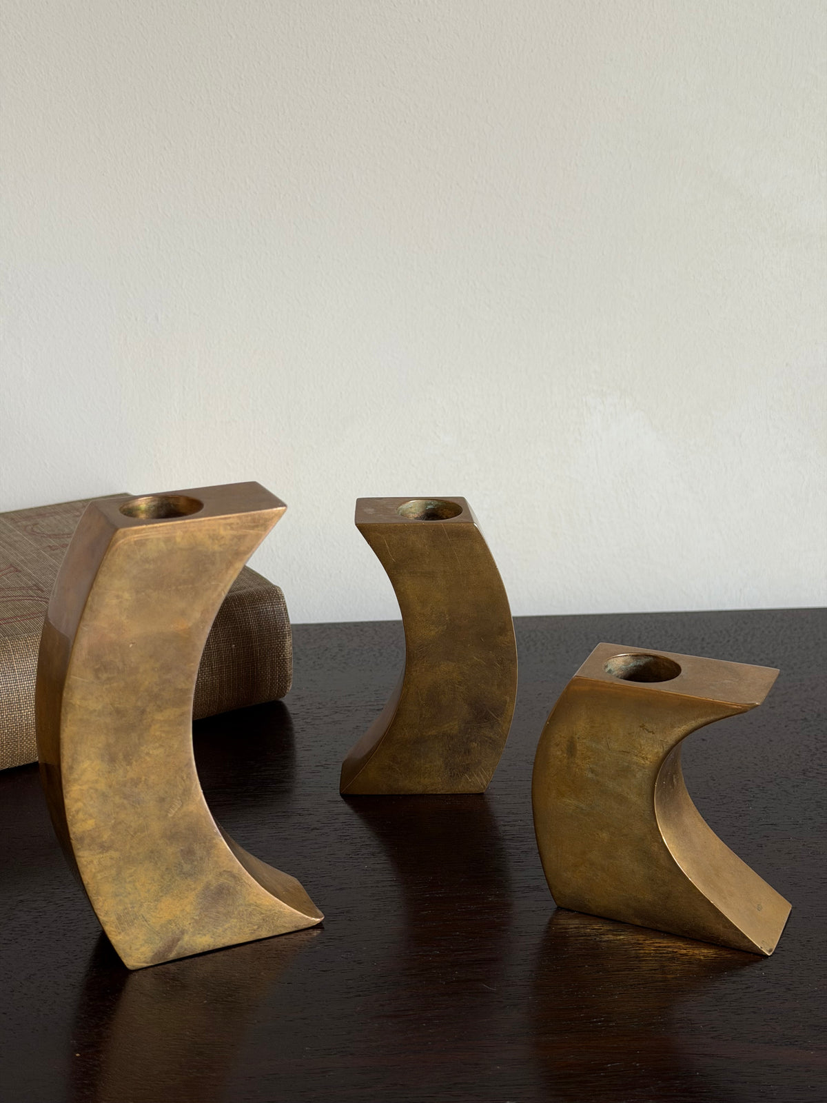 Set of Three Sculptural Solid Brass Candlesticks